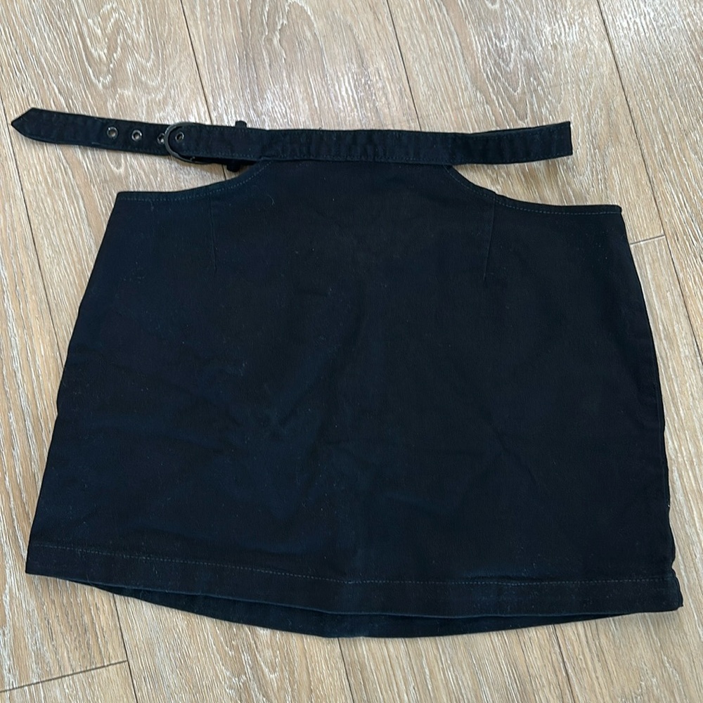 Black, denim, mini skirt with waist cut out. WeWoreWhat size large.